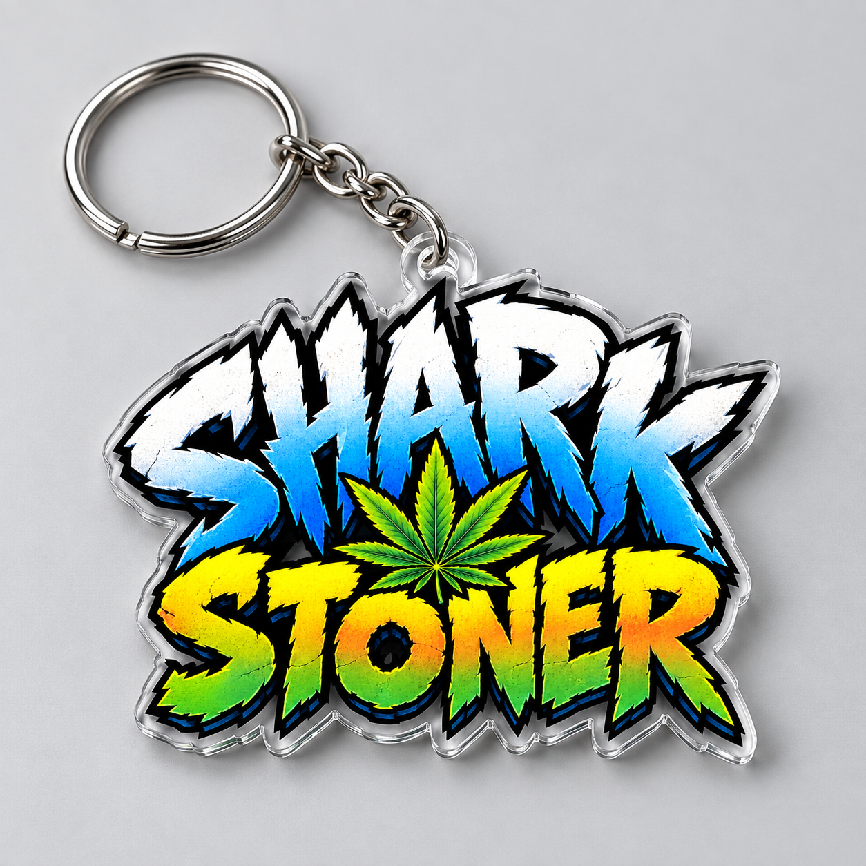 Logo-shaped Shark Stoner keychain with a silver ring